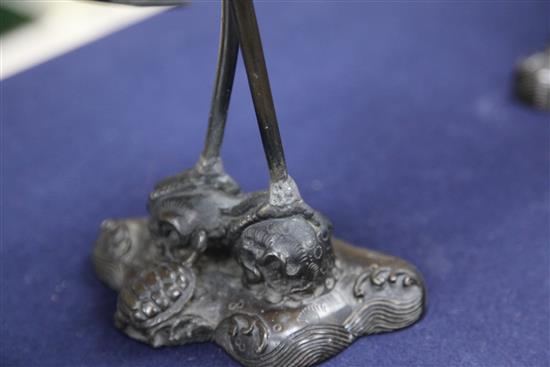 A pair of Japanese crane candelabra, late 19th century, 31.5cm., repairs